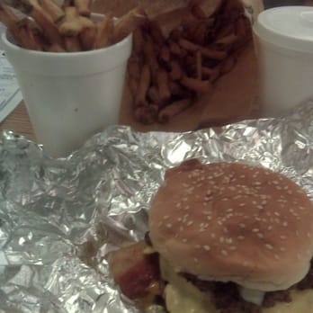 Five Guys - Regular Burger with Bacon, cheese, onion, ketchup, mustard w reg. fries overflowing from the cup into the bag. - Hot Dogs Near Me - Knightdale, North Carolina Five Guys - Regular Burger with Bacon, cheese, onion, ketchup, mustard w reg. fries overflowing from the cup into the bag. - Hot Dogs Near Me - Knightdale, North Carolina