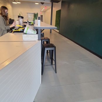 Buzz Nutrition - a woman sitting at a counter - Juice Bars & Smoothies Near Me - Shawnee, Kansas Buzz Nutrition - a woman sitting at a counter - Juice Bars & Smoothies Near Me - Shawnee, Kansas