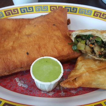 Jubba - Mandusa = fried sweet dough and sambusa = filled with ground beef and onion - African Near Me - San Jose, California Jubba - Mandusa = fried sweet dough and sambusa = filled with ground beef and onion - African Near Me - San Jose, California