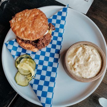 Chicory - Hot Chicken Sandwich - cooked to perfection paired with grits - New American Near Me - Olympia, Washington Chicory - Hot Chicken Sandwich - cooked to perfection paired with grits - New American Near Me - Olympia, Washington
