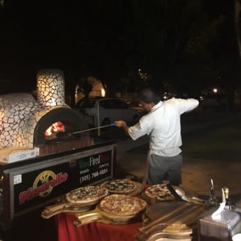 Pizzarello - Rubens at work with his portable oven, turning out deliciousness! - Pizza Near Me - Miami, Florida Pizzarello - Rubens at work with his portable oven, turning out deliciousness! - Pizza Near Me - Miami, Florida