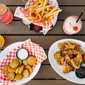 Takoda Navy Yard - two plates of fried chicken and fries - Beer Gardens Near Me - Washington, DC, District of Columbia Takoda Navy Yard - two plates of fried chicken and fries - Beer Gardens Near Me - Washington, DC, District of Columbia