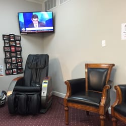 Super Value Pharmacy - Waiting area with pay per use massage chair and other comfy chairs.
