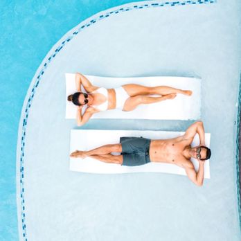 Olakino - two men lounging in a pool - Swimming Pools Near Me - Wailea, Hawaii Olakino - two men lounging in a pool - Swimming Pools Near Me - Wailea, Hawaii