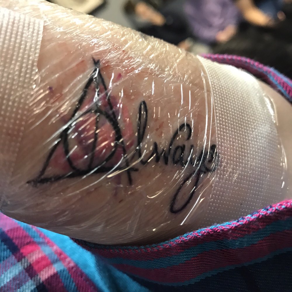 I will update with better photo later but it's a Harry Potter deathly hallows symbol with water color that says always by Steven Jackson I will update with better photo later but it's a Harry Potter deathly hallows symbol with water color that says always by Steven Jackson