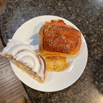 Bloom Bake Shop - Cinnamon roll and a Ham & Gruyère cheese pan (I think they call it a croissant but it isn't). - Bakeries Near Me - Madison, Wisconsin Bloom Bake Shop - Cinnamon roll and a Ham & Gruyère cheese pan (I think they call it a croissant but it isn't). - Bakeries Near Me - Madison, Wisconsin