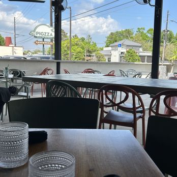 Pigzza - Lovely view of outdoors. We love the glassware. - Pizza Near Me - Orlando, Florida