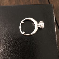 J Sampieri - Engagement ring with small white gold beads added to prevent it from moving side-to-side.