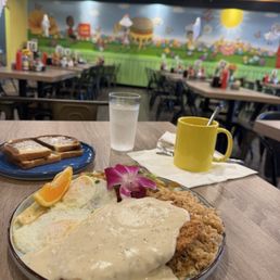 Chicken fried steak, half fried rice half breakfast potatoes, over medium eggs. Chicken fried steak, half fried rice half breakfast potatoes, over medium eggs.
