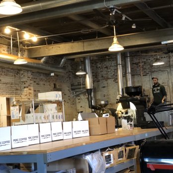 PERC Coffee - My view from where I'm working. Pouring beans into the roaster. I wish you could smell it in here. - Coffee & Tea Near Me - Savannah, Georgia