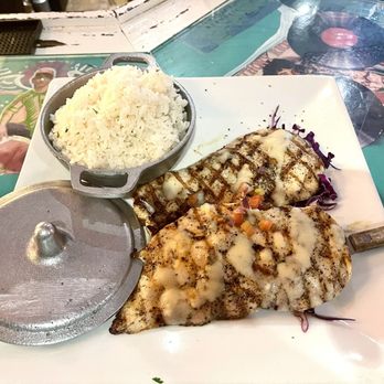 Ajo y Oregano - Pollo a la Parrilla (Grilled Chicken breast) with diced tomatoes and garlic sauce and white rice - Dominican Near Me - Bronx, New York Ajo y Oregano - Pollo a la Parrilla (Grilled Chicken breast) with diced tomatoes and garlic sauce and white rice - Dominican Near Me - Bronx, New York