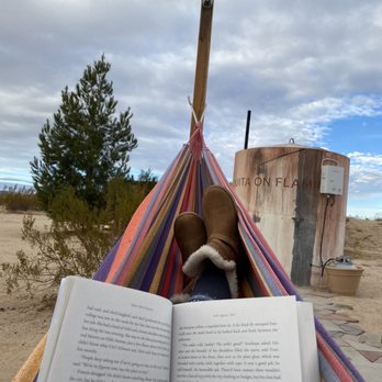 Joshua Tree Vacations - Enjoying the peaceful morning with a good book. - Vacation Rentals Near Me - Joshua Tree, California Joshua Tree Vacations - Enjoying the peaceful morning with a good book. - Vacation Rentals Near Me - Joshua Tree, California
