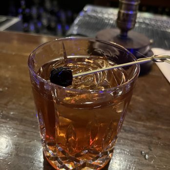 Toujouse Bar - a drink in a glass with a spoon - Lounges Near Me - Galveston, Texas Toujouse Bar - a drink in a glass with a spoon - Lounges Near Me - Galveston, Texas