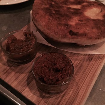 Kachka - Khachapuri - smoked cheese stuffed bread, crisp and melts. Sour plum and chile paste for dipping. - Russian Near Me - Portland, Oregon Kachka - Khachapuri - smoked cheese stuffed bread, crisp and melts. Sour plum and chile paste for dipping. - Russian Near Me - Portland, Oregon