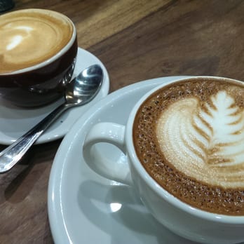Dancing Goats Coffee - cortado (left) and traditional cappuccino (right) - Coffee & Tea Near Me - Decatur, Georgia Dancing Goats Coffee - cortado (left) and traditional cappuccino (right) - Coffee & Tea Near Me - Decatur, Georgia