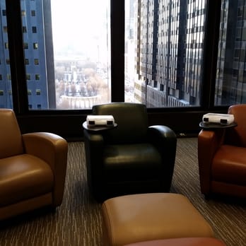 Summit Chicago - Room setup with soft furniture in a circle for a small group with a view overlooking Millennium Park. - Venues & Event Spaces Near Me - Chicago, Illinois