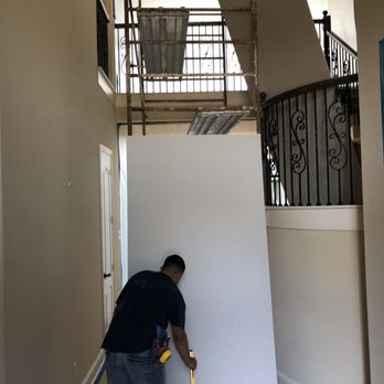 Custom Restoration and Remodel - a man working on a wall - Damage Restoration Near Me Custom Restoration and Remodel - a man working on a wall - Damage Restoration Near Me