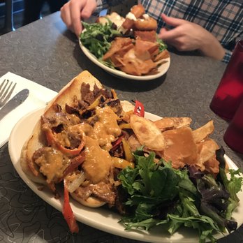 Veggie Galaxy - I got the cheesesteak (&asked for the vegan cheese) with chips, and my boyfriend got the buffalo chicken sandwhich topped with onion rings - Breakfast & Brunch Near Me - Cambridge, Massachusetts