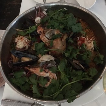 Ostra - Paella with lots of cilantro - Seafood Near Me - Boston, Massachusetts Ostra - Paella with lots of cilantro - Seafood Near Me - Boston, Massachusetts