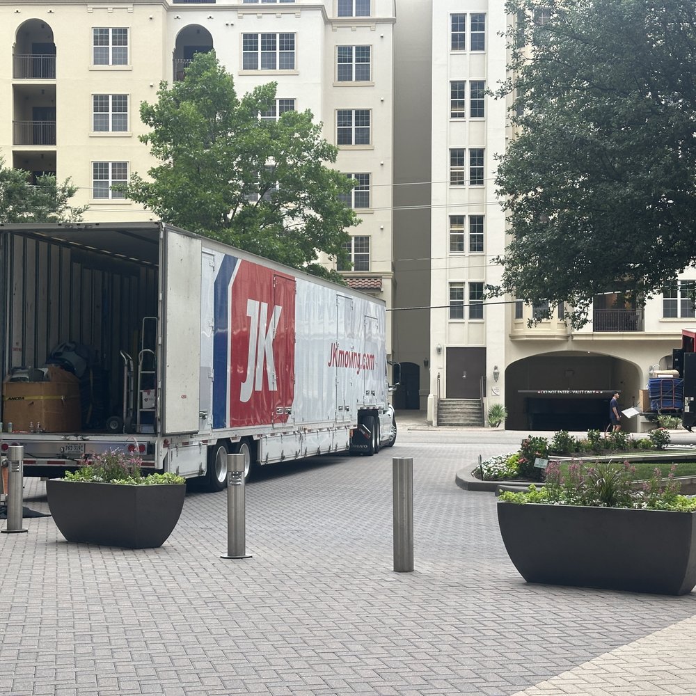 The 18-wheeler arrived early near downtown Dallas and perfectly backed in to the circular driveway in front of the high rise. The 18-wheeler arrived early near downtown Dallas and perfectly backed in to the circular driveway in front of the high rise.