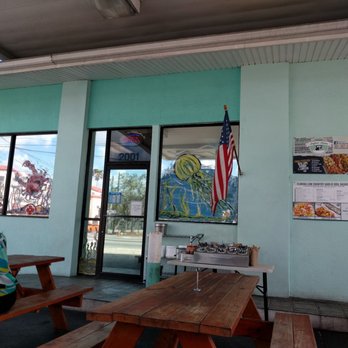 Melbourne Seafood Station - The outdoor seating area with supplies for your feast. Share your tables! - Seafood Near Me - Melbourne, Florida Melbourne Seafood Station - The outdoor seating area with supplies for your feast. Share your tables! - Seafood Near Me - Melbourne, Florida