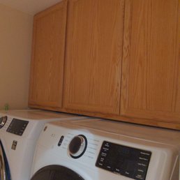 Washer and dryer with pedestals for just right under the cabinet now!