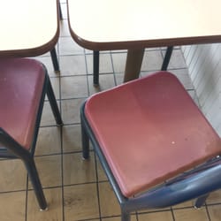 KFC - Dirty chairs, tables and floor.