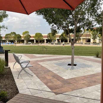 Hillcrest Village Green - Wide green space with restaurants that have outdoor patios reaching the edges - Parks Near Me - Dallas, Texas