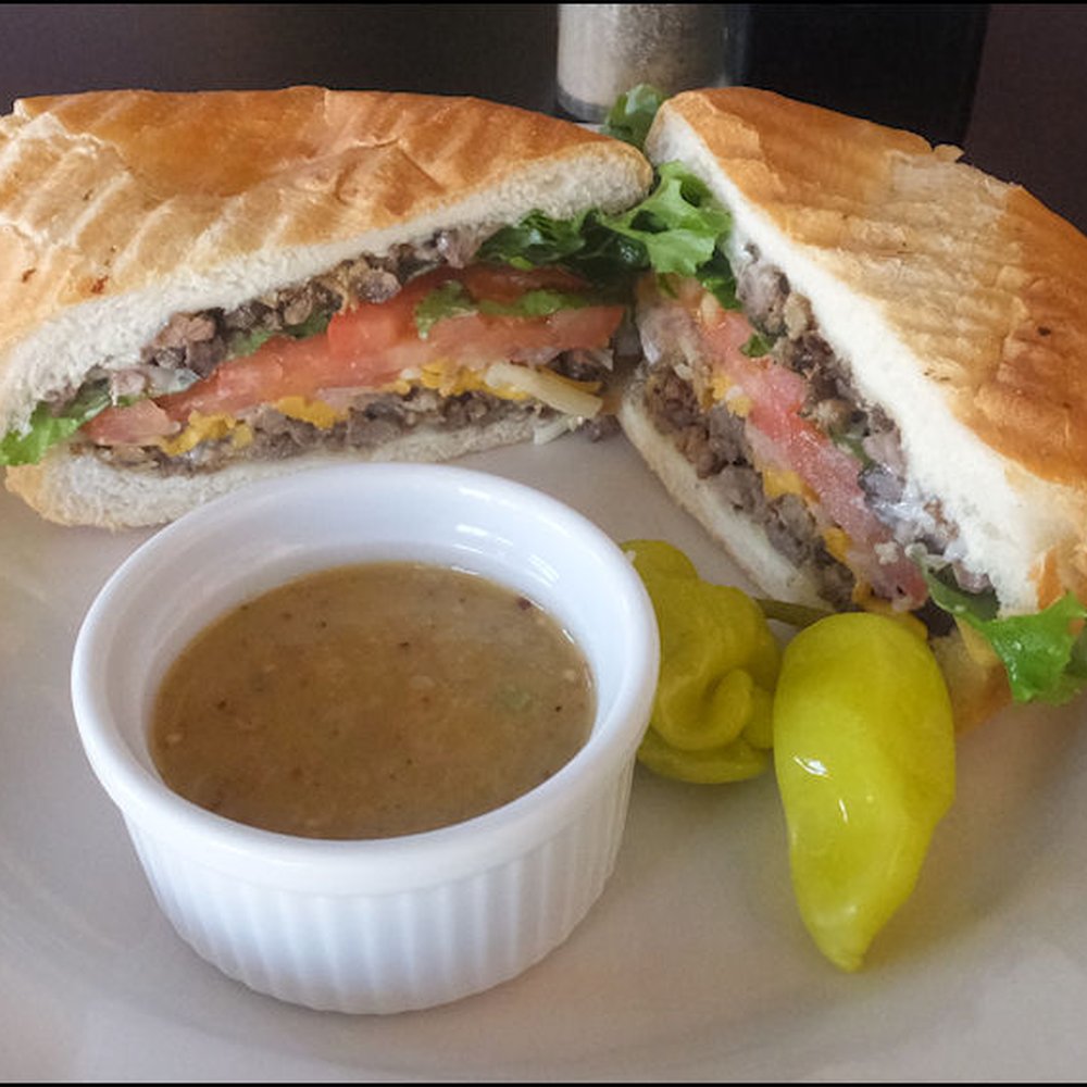 Bronco's Deli - My "Carne Asada Torta," from the Mexican side of the menu, for only $7.15.  The sandwich included a couple of sport peppers and a small bowl - Delis Near Me - Bishop, California