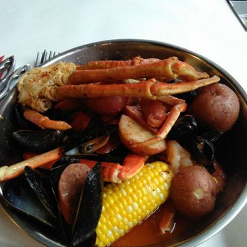 Mad Seafood Boiler - Our Combo A!: 1/2 lb snowcrab legs, 1/2 lb shrimp, 1/2 lb mussels, corn, potatoes, and sausage. One of our sausages impersonated a mussel... - Cajun/Creole Near Me - Madison, Wisconsin Mad Seafood Boiler - Our Combo A!: 1/2 lb snowcrab legs, 1/2 lb shrimp, 1/2 lb mussels, corn, potatoes, and sausage. One of our sausages impersonated a mussel... - Cajun/Creole Near Me - Madison, Wisconsin
