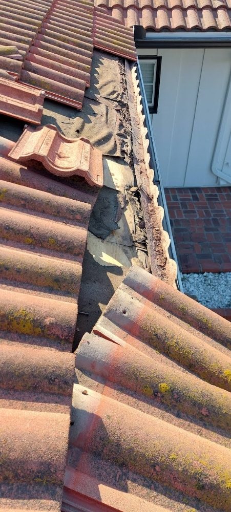 Slide of The Roofing Company