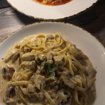 Mamma Mia - Fettuccini Alfredo with chicken and mushrooms in the front beef lasagna in the back - Italian Near Me - Riverside, California Mamma Mia - Fettuccini Alfredo with chicken and mushrooms in the front beef lasagna in the back - Italian Near Me - Riverside, California