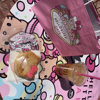Hello Kitty Cafe - Seating area, peach iced tea, and Hello kitty pastry - Desserts Near Me - Las Vegas, Nevada
