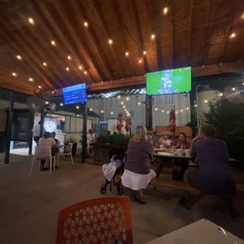 Tacos and Avocados - Outside patio watching football while the families around us enjoy music and ambience - Tacos Near Me - Carrollton, Texas