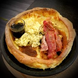 Dutch baby with a side of eggs and bacon Dutch baby with a side of eggs and bacon