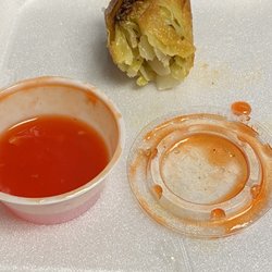 New China - What's left of an egg roll with included sauce