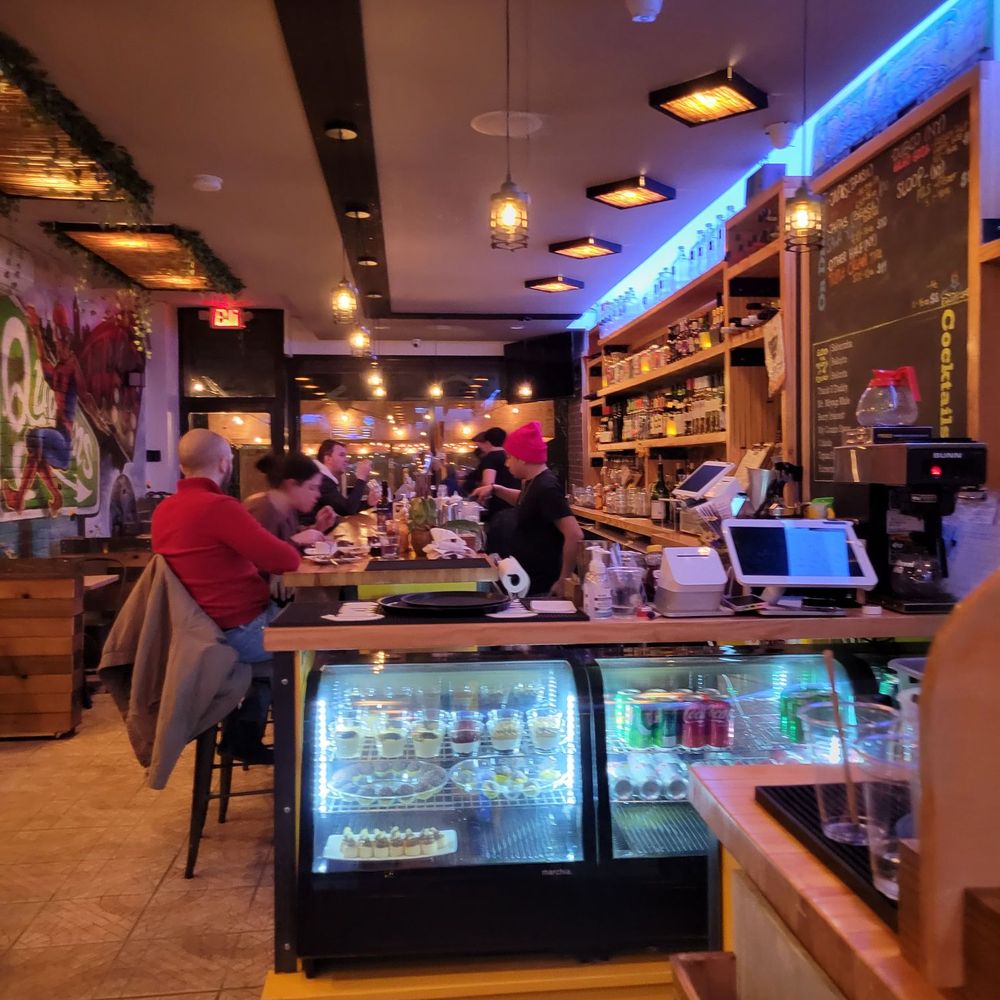 Belo - people sitting at a counter in a restaurant - Brazilian Near Me - Sunnyside, New York