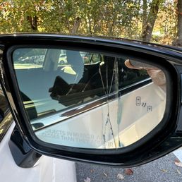 Part of the mirror was lying on the ground when we picked up our car, and the lot attendant quickly put it back on hoping we wouldn't notice Part of the mirror was lying on the ground when we picked up our car, and the lot attendant quickly put it back on hoping we wouldn't notice