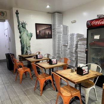 New York Roma Pizza - empty tables and chairs - Pizza Near Me - Miami, Florida New York Roma Pizza - empty tables and chairs - Pizza Near Me - Miami, Florida