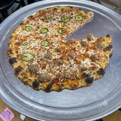 Van’s Brick Oven Pizza - Half Italian sausage and half jalapeño. Yummy!