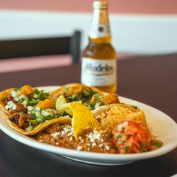 Dos Amigos Mexican Restaurant - Taco Plate Dinner.
4 tacos (choice of meat) served with rice, beans and pico de gallo.