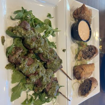 Stella Point Grille - Steak bites with chimichurri and steak & cheese egg rolls. - Bars Near Me - Kensington, Maryland Stella Point Grille - Steak bites with chimichurri and steak & cheese egg rolls. - Bars Near Me - Kensington, Maryland