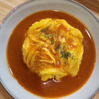 Lucky Pig - Omurice: scrambled egg on top of fried rice with special gravy sauce - Korean Near Me - Whittier, California