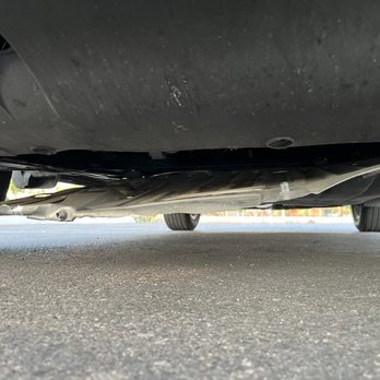 Sun Devil Auto - Close up of unsecured tray and associated damage - Auto Repair Near Me - Goodyear, Arizona