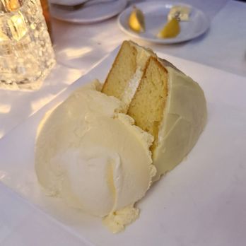 John Henry's - Sunny Lemon Cake served a la mode with a pint (no kidding) of vanilla ice cream. - American Near Me - Palm Springs, California John Henry's - Sunny Lemon Cake served a la mode with a pint (no kidding) of vanilla ice cream. - American Near Me - Palm Springs, California