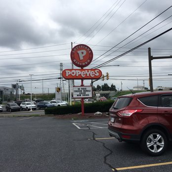Popeyes Louisiana Kitchen - a car parked in a parking lot - Chicken Wings Near Me - Lancaster, Pennsylvania