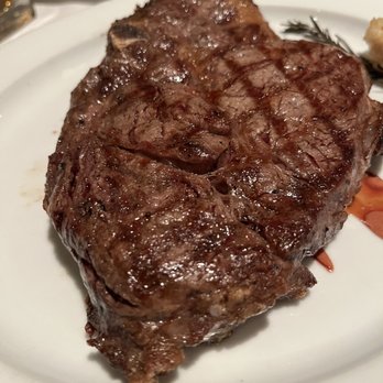 William B's Steakhouse - Bone in ribeye. Was skeptical but cooked sooooo good morning he chef was a master!! - Steakhouses Near Me - Michigan City, Indiana William B's Steakhouse - Bone in ribeye. Was skeptical but cooked sooooo good morning he chef was a master!! - Steakhouses Near Me - Michigan City, Indiana