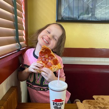 Pizza Hut - a little girl eating a slice of pizza - Pizza Near Me - Bolivar, Missouri Pizza Hut - a little girl eating a slice of pizza - Pizza Near Me - Bolivar, Missouri
