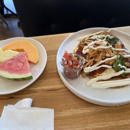 Chilaquiles with side of fruit Chilaquiles with side of fruit