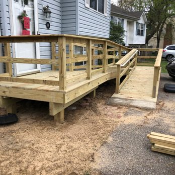Improvement Zone - a new deck being installed in front of a house - General Contractors Near Me - Stevensville, Maryland Improvement Zone - a new deck being installed in front of a house - General Contractors Near Me - Stevensville, Maryland